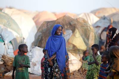 FILE PHOTO: A girl stands in front of a makeshift shelter at the new Kabasa internally displaced camp in the northern Somali town of Dollow, Somalia, February 25, 2018. Picture taken February 25, 2018. REUTERS/Baz Ratner/File Photo