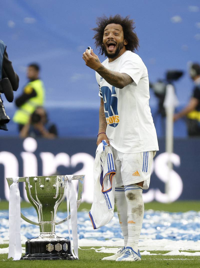 Real's Marcelo celebrates with the trophy. Reuters