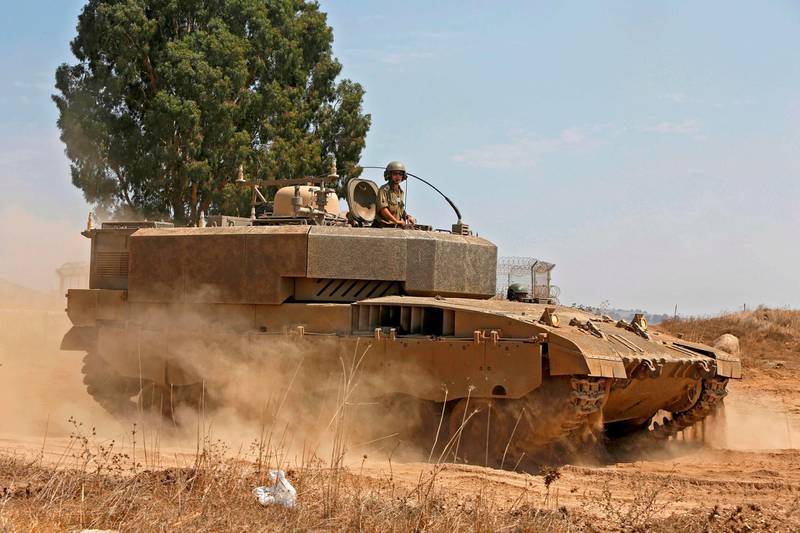 An Israeli tank takes part in a military drill in the Israeli-annexed Golan Heights on September 1, 2020. / AFP / JALAA MAREY

