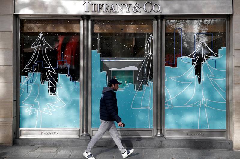 epa08024205 A man walks by a Tiffany & Co shop on the Champs Elysees in Paris, France, 25 November 2019. According to reports on 25 November 2019, French luxury group LVMH is buying US jewelry chain Tiffany & Co for a USD 16.2 billion,  its biggest-ever acquisition  EPA/YOAN VALAT