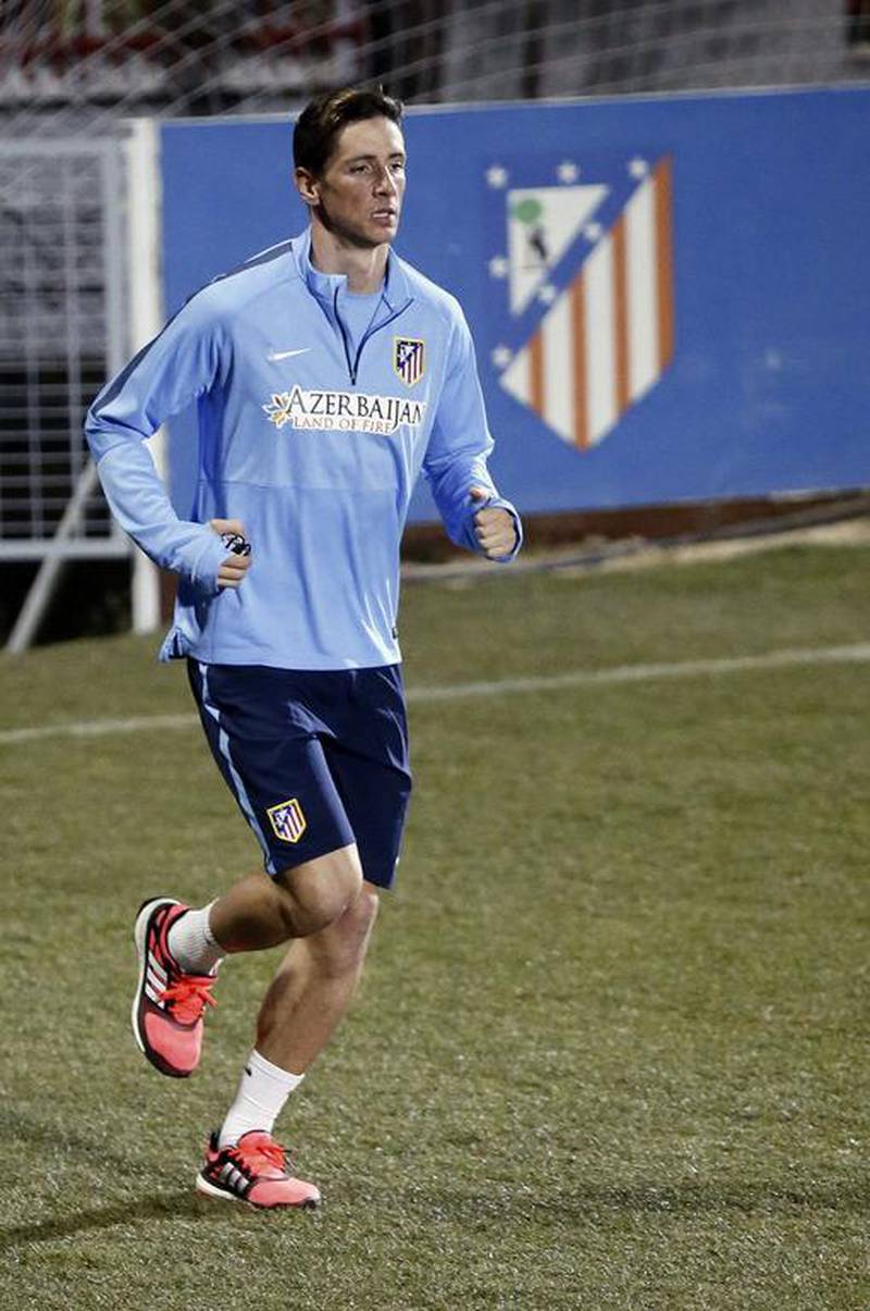 Fernando Torres jogs during Atletico Madrid's team training session on Tuesday. Fernando Alvarado / EPA