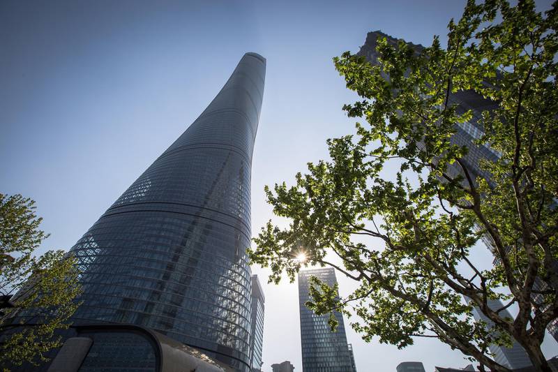 epa06793921 Shanghai Tower in Pudong area, Shanghai, China, 19 April 2018. The Shanghai Tower is 632 meters tall and has 128 floors. It is the tallest building in China and the world's second tallest building. The exterior of the building resembles a snake as it spirals upwards. The sky is the limit when it comes to tall buildings, which has sparked a worldwide race between nations to construct ever higher.  EPA-EFE/ROMAN PILIPEY