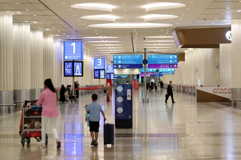 Travellers at Dubai International Airport's Terminal 3. Chris Whiteoak / The National