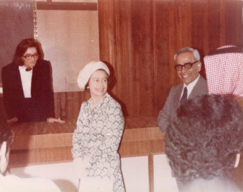 Prof Amel Amin-Zaki concludes a lecture on the first performances of Shakespeare in Arabic. The photograph from 1979 shows Queen Elizabeth II next to UAE Founding Father Sheikh Zayed and United Arab Emirates University president Dr Abdulaziz Al Bassam. Photo: Feisal al-Istrabadi