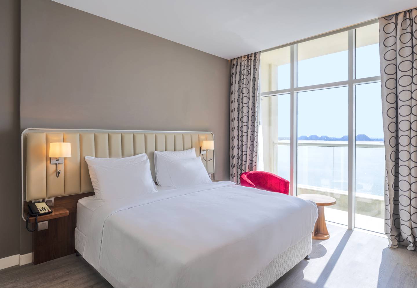 A one-bedroom suite with a sea view and balcony at Radisson Resort Ras Al Khaimah Marjan Island. Photo: Supplied