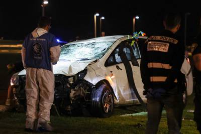 Israeli police with the wreck of the car car used in a ramming attack in Tel Aviv. One man was killed and five people were wounded. AFP
