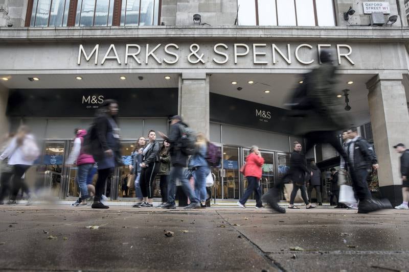 Shoppers walk past a Marks & Spencer Group Plc (M&S) retail store on Oxford Street in London, U.K., on Tuesday, May. 29, 2018. U.K. consumer confidence slid this month as Britons felt less secure about their jobs and the value of their houses. Photographer: Simon Dawson/Bloomberg