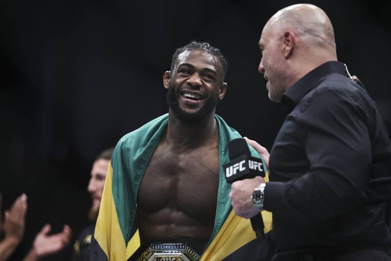 Aljamain Sterling talks with Joe Rogan after his UFC bantamweight championship fight against Petr Yan of Russia at UFC 273 at VyStar Veterans Memorial Arena on April 09, 2022 in Jacksonville, Florida. Sterling won by split decision. AFP
