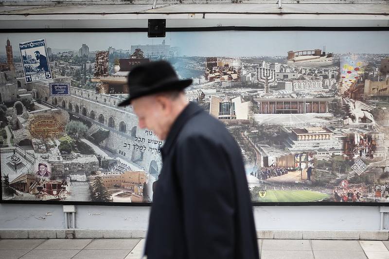 A Jewish man passes a mural of the Mutual Association Israelita Argentina (AMIA), in Buenos Aires, Argentina, 21 January 2020. The Jewish community of Argentina, the largest in Latin America and one of the most numerous in the world, carries multiple scars. Juan Ignacio Roncoroni / EPA