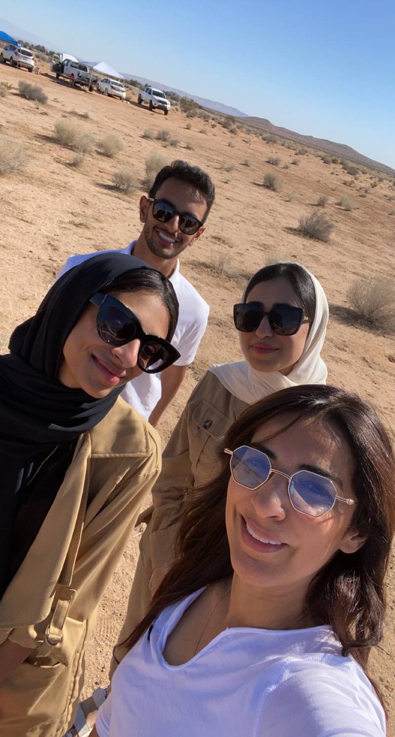 Mr Baslaib, Rawand Al Hashmi, left, Shouq Al Saadi, second right, and Decenture founder Loubna Hadid in the Mojave Desert in California.