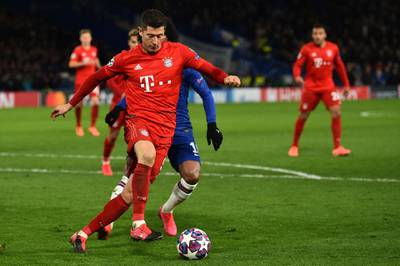 Bayern Munich's Polish striker Robert Lewandowski vies with Chelsea's Brazilian midfielder Willian. AFP
