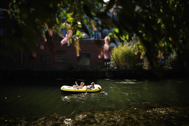Two girls make their way down the Regent's Canal in London in 2014.