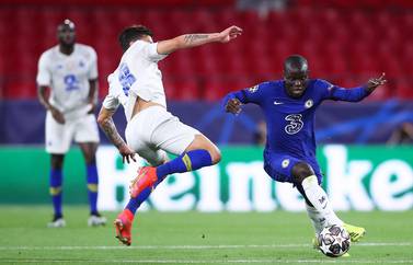 N'Golo Kante of Chelsea competes for the ball with Mateus Uribe of Porto during their Uefa Champions League quarter-final, second-leg match at Estadio Ramon Sanchez Pizjuan in Seville, Spain, on April 13, 2021. Getty Images