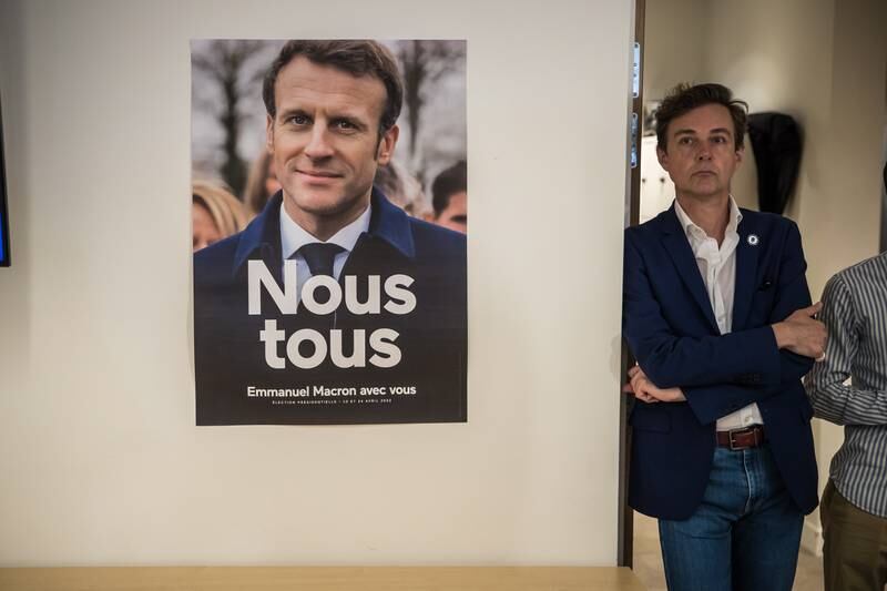 A poster of French President Emmanuel Macron at an electoral party in Paris. EPA
