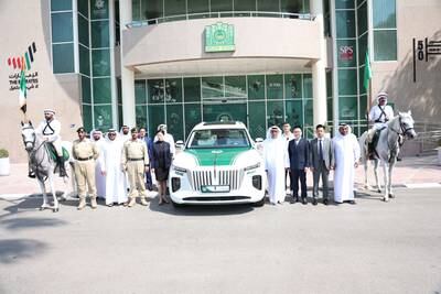 Dubai Police took delivery of a Hongqi E-HS9 suv vehicle -  the force's first electric vehicle - from Oneroad Automotive Company at the Dubai Police Officers Club. Dubai Police
