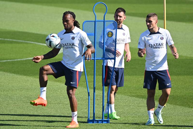 Paris Saint-Germain's Portuguese midfielder Renato Sanches controls the ball next to Lionel Messi and Marco Verratti during a training session at the Camp des Loges training ground in Saint-Germain-en-Laye, west of Paris on August 11, 2022, two days prior to the L1 football match against Montpellier.  AFP