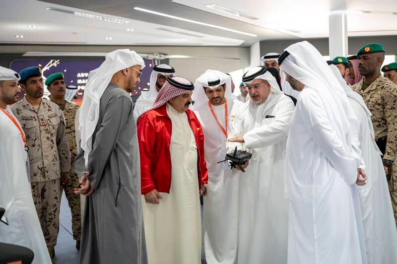 President Sheikh Mohamed and King Hamad tour the event. Seen with Crown Prince Salman bin Hamad, First Deputy Supreme Commander of Bahrain.