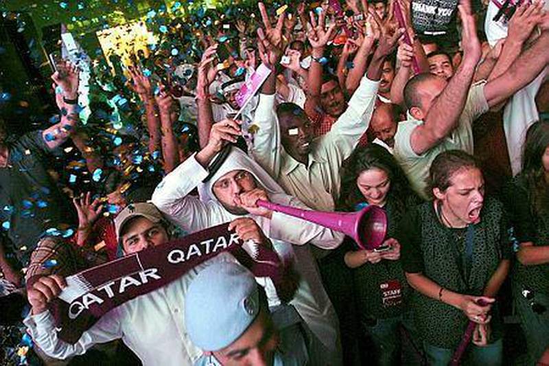 Qatari soccer fans celebrate in the streets following the announcement that Qatar will host the 2022 Soccer World Cup in Doha, Qatar, on December 2, 2010. EPA/MOHAMED FARAG