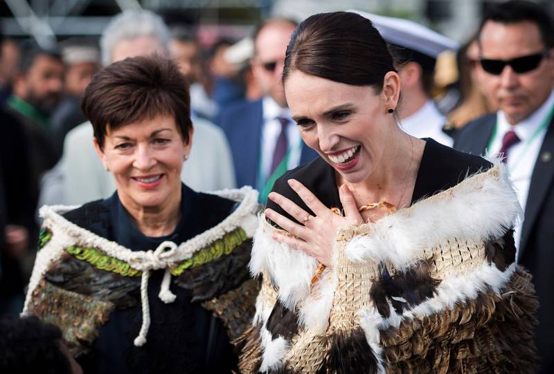 In this image supplied by the New Zealand government, New Zealand Prime Minister Jacinda Ardern, right, reacts as she meets members of the Muslim community following the national remembrance service for the victims of the March 15 mosques terrorist attack at Hagley Park in Christchurch, New Zealand, Friday, March 29, 2019. (Mark Tantrum via AP)
