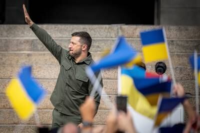 Mr Zelenskyy greets a crowd in front of the Danish Parliament, in Copenhagen, in August. Reuters
