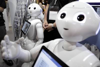 SoftBank Group Corp.'s Pepper humanoid robots stand at a booth at SoftBank World 2017 in Tokyo, Japan, on Thursday, July 20, 2017. SoftBank World, the company’s annual two-day event for customers and suppliers, runs through July 21. Photographer: Kiyoshi Ota/Bloomberg