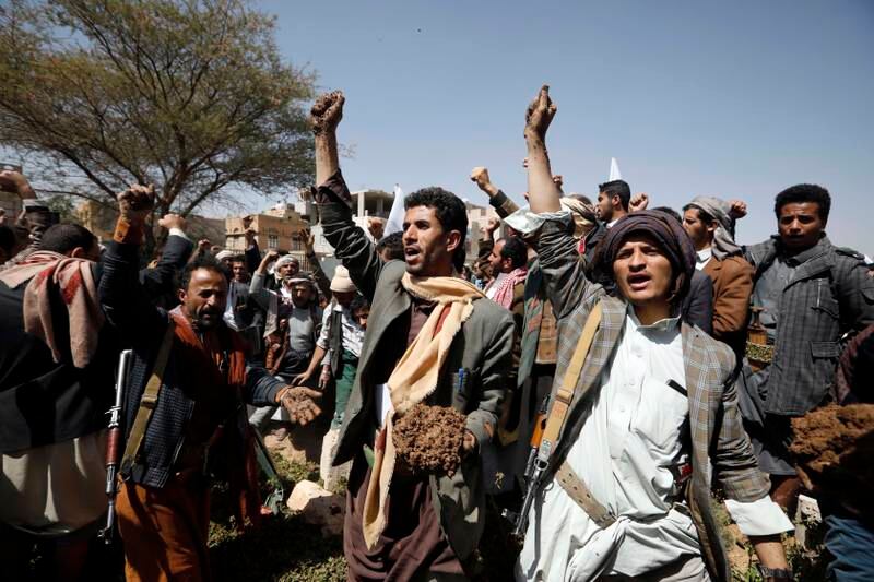Yemenis shout slogans as they bury the bodies of Houthi fighters killed in ongoing battles for control of the government-held province of Marib, during a funeral in Sanaa, on Wednesday. Photo: EPA