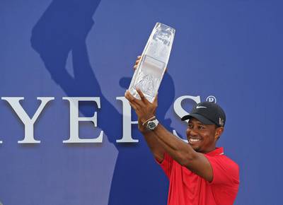 PONTE VEDRA BEACH, FL - MAY 12: Tiger Woods poses with the tournament trophy after winning THE PLAYERS Championship on THE PLAYERS Stadium Course at TPC Sawgrass on May 12, 2013 in Ponte Vedra Beach, Florida. (Photo by Chris Condon/PGA TOUR/Getty Images) 