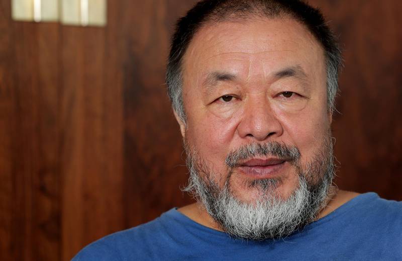 Chinese artist Ai Weiwei poses for a photo after an interview with The Associated Press in Berlin, Germany, Monday, Aug. 12, 2019. (AP Photo/Michael Sohn)