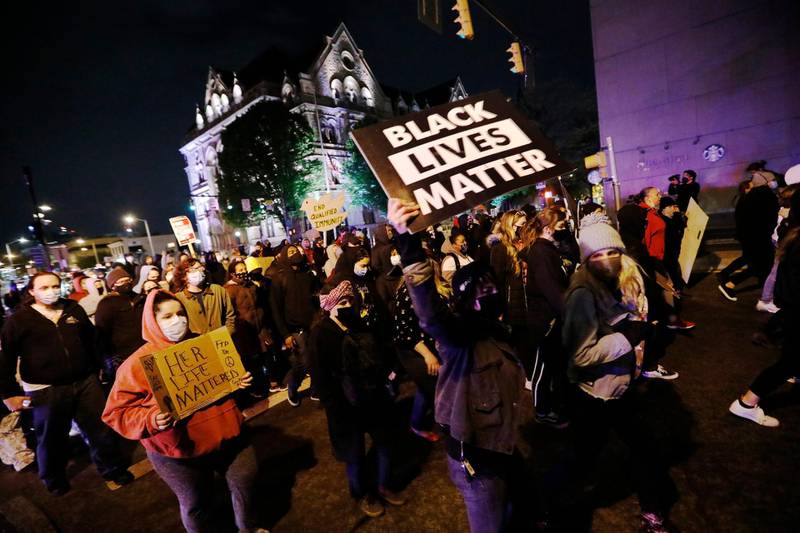 Protesters march in downtown Columbus, Ohio, Tuesday, April 20, 2021. Police shot and killed a teenage girl Tuesday afternoon in Columbus just as the verdict was being announced in the trial for the killing of George Floyd. Police showed bodycam footage Tuesday night at a news conference of the officer shooting the girl, who was Black, as she appeared to attempt to stab two people with a knife. (Adam Cairns/The Columbus Dispatch via AP)