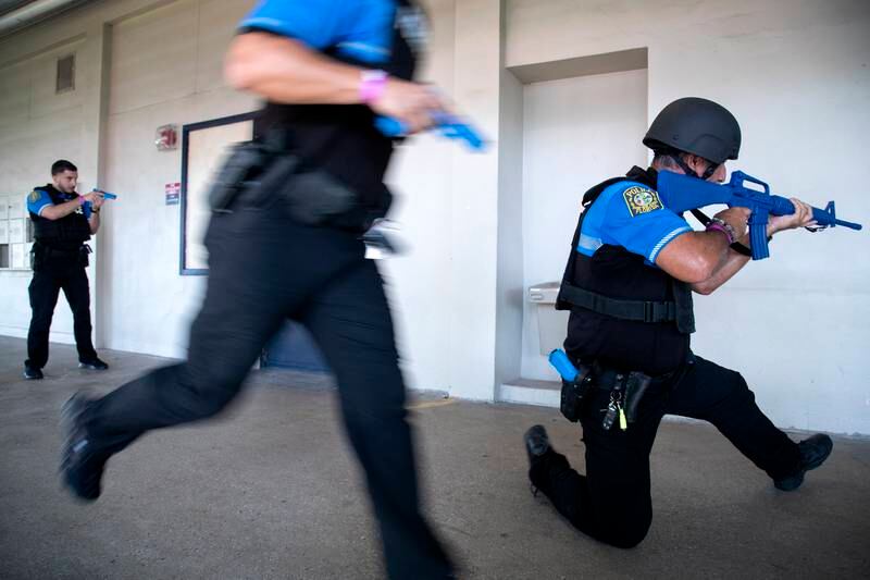 Miami-Dade Police officers participate in a functional active shooter drill at the Hialeah Senior High School in Hialeah, Florida, USA.  According to the organizers, the Miami-Dade Schools Police Department conducted a large-scale active shooter/mass casualty functional drill to assess the capabilities of various internal and external district resources, including the Miami-Dade Schools Police Department, local hospitals, local law enforcement agencies, and other critical District Divisions.   EPA 
