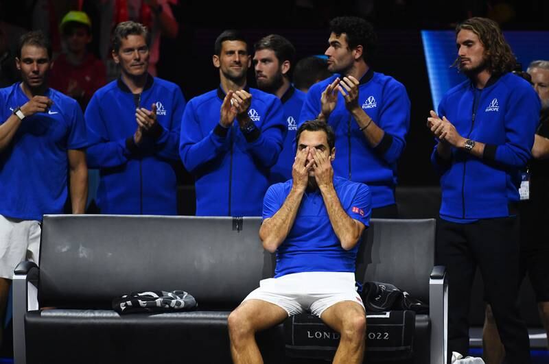 Team Europe player Roger Federer (seated) of Switzerland is applauded by teammates (from L) Rafael Nadal of Spain, Team Europe vice captain Thomas Enqvist of Sweden, Novak Djokovic of Serbia, Cameron Norrie of Great Britain, Matteo Berrettini of Italy and Stefanos Tsitsipas of Greece after playing the doubles match with Nadal against Team World double Jack Sock of the US and Frances Tiafoe of the US, on the first day of the Laver Cup tennis tournament in London, on September 23, after the match that was Federer's last game before retirement. EPA