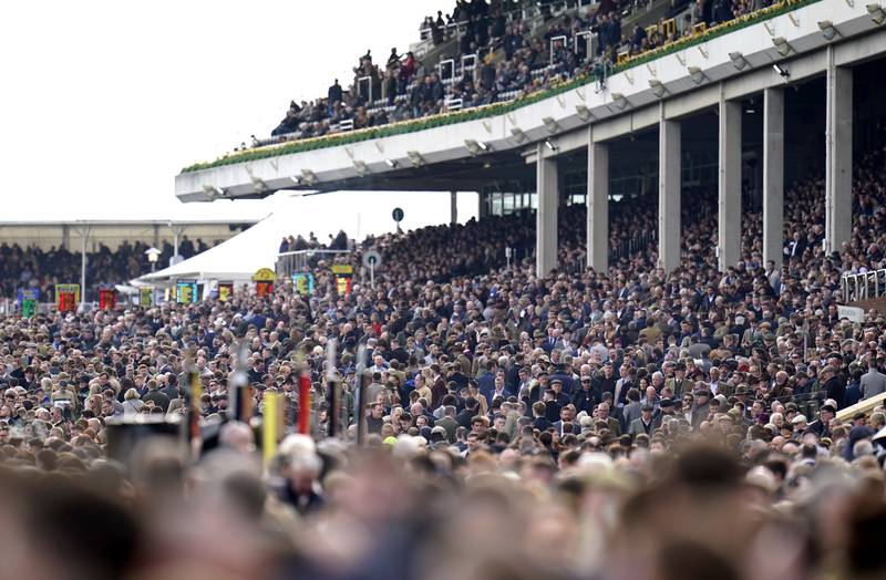 Crowds during day one of the Cheltenham Festival. PA