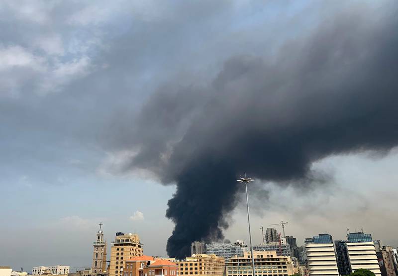 Smoke is seen from a huge fire raging in Beirut port. The army said it had engulfed a warehouse storing engine oil and vehicle tyres. AFP