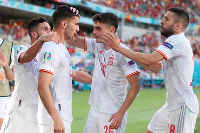 Spain's Ferran Torres, second from left, celebrates with his teammate after scoring his side's fourth goal during the Euro 2020 match against Slovakia at La Cartuja stadium in Seville on Wednesday, June 23, 2021. AP