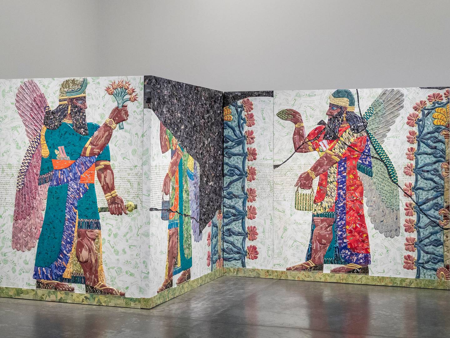 Rakowitz's Green Art exhibition reimagines ninth-century BC bas-reliefs from the Northwest Palace of Kalhu with bright colours and eccentric details. Antonie Robertson / The National
