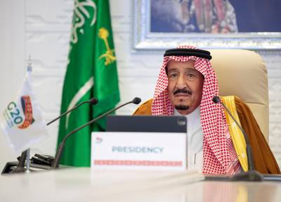 Saudi King Salman gives a virtual speech during an opening session of the 15th annual G20 Leaders' Summit in Riyadh. Saudi Royal Court HO via REUTERS