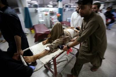 A wounded man is taken for treatment at a hospital in Peshawar following a blast in Bajaur, Pakistan. EPA