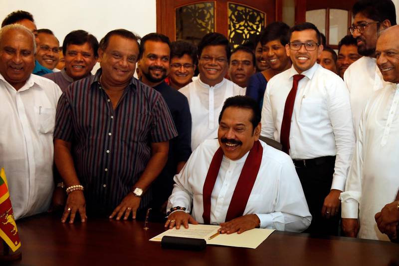 epa07232409 Former Sri Lankan President Mahinda Rajapaksa during the signing of his letter of resignation from the Prime Minister's post at his official residence in Colombo, Sri Lanka, 15 December 2018. Mahinda Rajapaksa has resigned as Sri Lanka's prime minister on 15 December 2018. President Maithripala Sirisena dissolved the 225-member Parliament headed by United National Party (UNP) leader Ranil Wickremesinghe as Prime Minister and appointed Mahinda Rajapaksa in his place on 26 October. President Sirisena and Mahinda Rajapaksa called for a snap general election on 05 January 2019. However, the UNP and several civil and other organizations filed as many as 13 petitions before the Supreme Court challenging the dissolution as being unconstitutional. A seven judge-bench of Sri Lanka's Supreme Court unanimously ruled that the Gazette notification issued by President Maithripala Sirisena dissolving Parliament was inconsistent with the constitution and such a dissolution could be made only when Parliament completes its four-and-a-half year term. Making a special statement before stepping down, Mahinda Rajapaksa said he does so since the premiership was useless without a general election being held and hence to make way for the President to take future necessary steps.  EPA/M.A.PUSHPA KUMARA