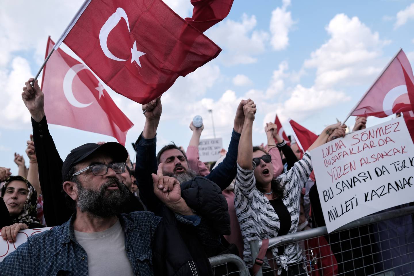 Protesters wave Turkish flags as they shout slogans against Covid-19-related mandates last month. Reuters