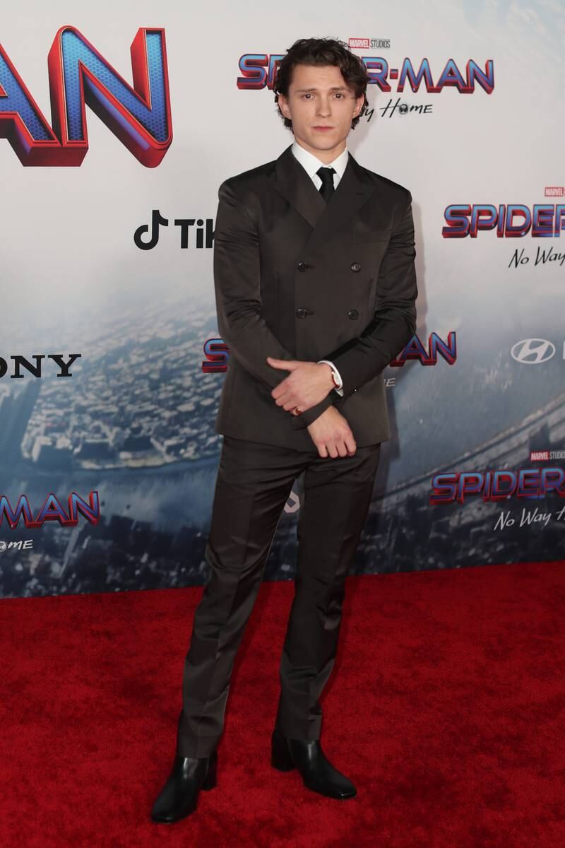 Tom Holland, in a black silk Prada double breasted suit, attends the 'Spider-Man: No Way Home' premiere in Los Angeles on December 13, 2021. EPA