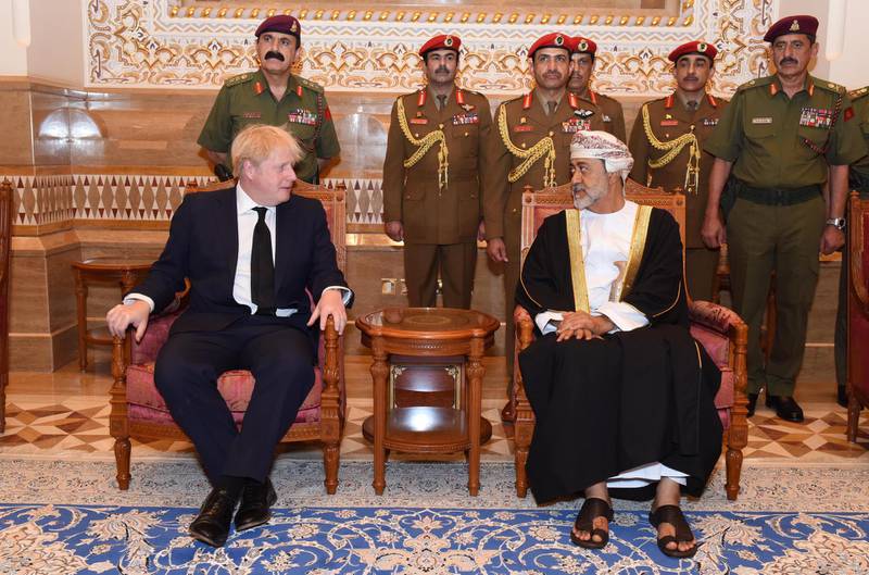 A handout picture released by the Omani News Agency shows Oman's newly sworn-in Sultan Haitham bin Tariq (R) receiving Britain's Prime Minister Boris Johnson in the capital Muscat on January 12, 2020. - Oman's Sultan Qaboos, who died on January 10 aged 79, transformed the former Arabian Peninsula backwater into a modern state and sought-after mediator while shielding the sultanate from a region in turmoil. Britain's Prince Charles and Prime Minister Boris Johnson joined regional leaders in Oman to offer their condolences to the royal family after the death of long-reigning Sultan Qaboos. (Photo by - / OMANI NEWS AGENCY / AFP) / RESTRICTED TO EDITORIAL USE - MANDATORY CREDIT "AFP PHOTO / HO /  OMANI NEWS AGENCY " - NO MARKETING NO ADVERTISING CAMPAIGNS - DISTRIBUTED AS A SERVICE TO CLIENTS
