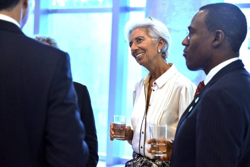 Managing director of the International Monetary Fund (IMF) Christine Lagarde, centre, talks with other attendants to the dinner of Finance Ministers of G20. EPA