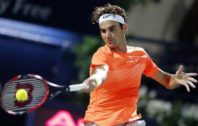 Roger Federer plays a shot on Monday against Mikhail Youzhny in the first round of the ATP Dubai Duty Free Tennis Championships. Ahmed Jadallah / Reuters
