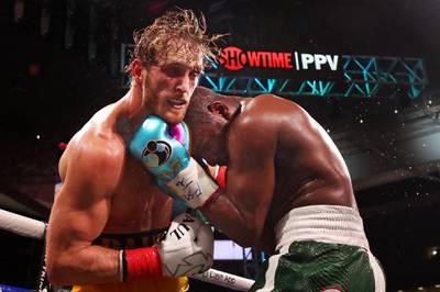 Floyd Mayweather exchanges blows with Logan Paul during their exhibition fight at Hard Rock Stadium. AFP