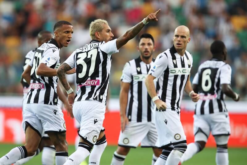 Udinese's Roberto Pereyra celebrates with teammates after scoring. EPA