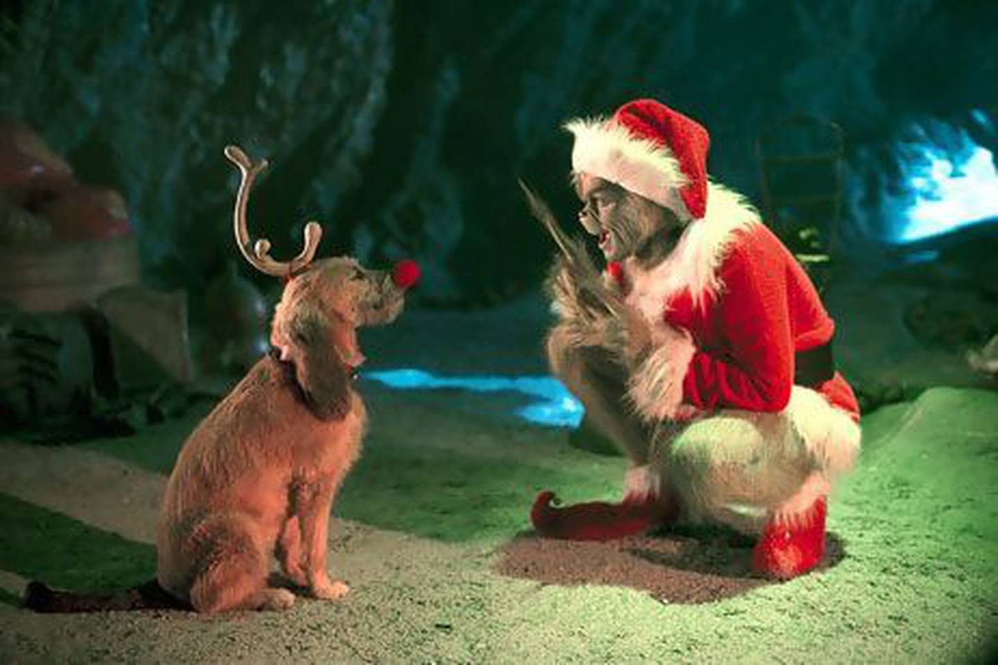 The Grinch, played by Jim Carrey, and his dog Max in "How the Grinch Stole Christmas." Bloomberg News