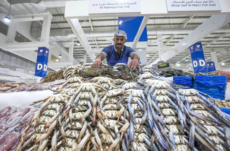 DUBAI, UNITED ARAB EMIRATES - Mohammed Nasir a vendor inside the seafood section at the Waterfront Market, Deira.  Leslie Pableo for The National