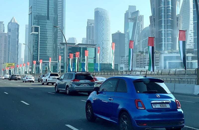 Flags on Sheikh Zayed Road in Dubai. Pawan Singh / The National 