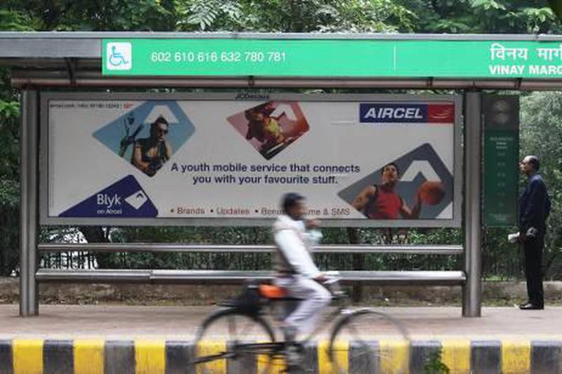 epa02465977 An Aircel advertising board seen at a busy street in New Delhi, India on 25 November 2010. The Indian 2G phone services scam controversy, that led to the resignation of A. Raja as the telecom minister, has forced India's telecom watchdog to recommend the scrapping of 69 of the 130 licenses given for 2G phone services since December 2006. 'The roll-out of services on these licenses has failed to comply with the set norms. Six companies had been given these 69 licenses,' a senior official of the Telecom Regulatory Authority of India (TRAI) said. Of the 69 licenses, 20 have been issued to Loop Telecom, 15 to Etisalat DB, 11 to Sistema-Shyam, 10 to Videocon, eight to Uninor and five to Aircel.  EPA/ANINDITO MUKHERJEE *** Local Caption ***  02465977.jpg