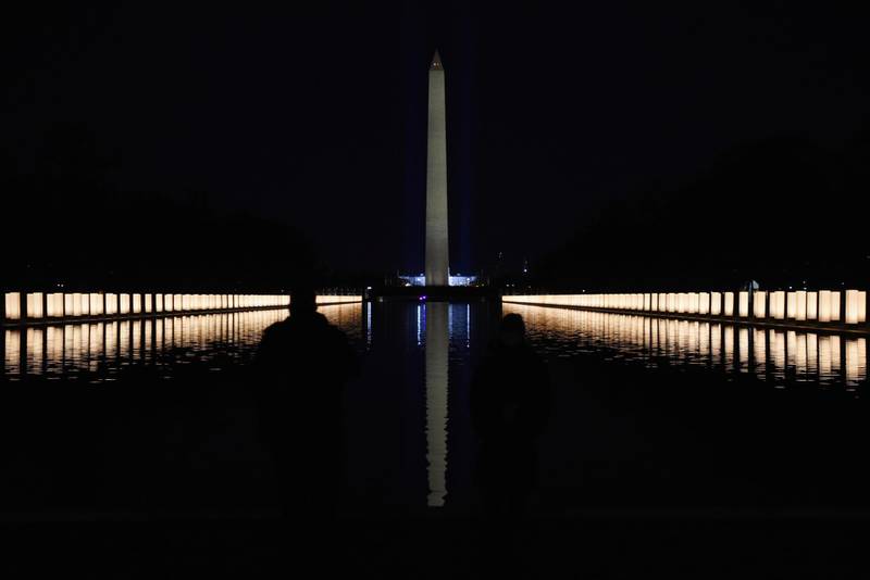 The Washington Monument is seen reflected after President-elect Joe Biden hosts a memorial to honor those who died from coronavirus disease (COVID-19), at the reflecting pool at the Lincoln Memorial, in Washington, U.S., January 19, 2021.    REUTERS/Callaghan O'Hare